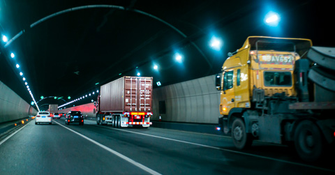Trucks driving through a tunnel